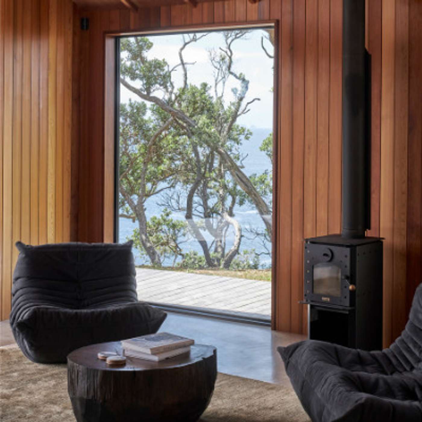 Nestled into a natural amphitheatre this coastal home is at one with the landscape episode artwork