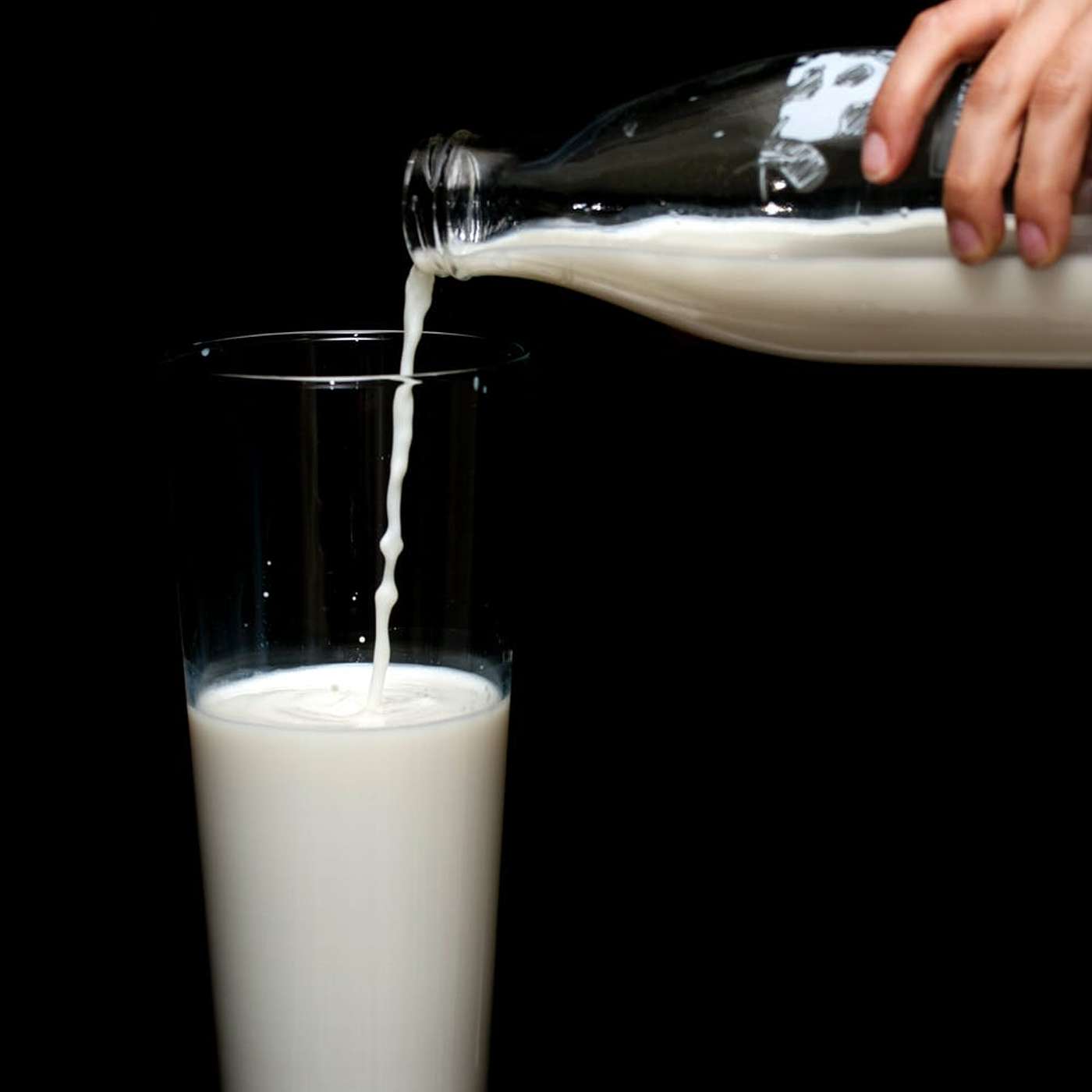 Pouring a Glass of Milk Pouring a Glass of Milk
